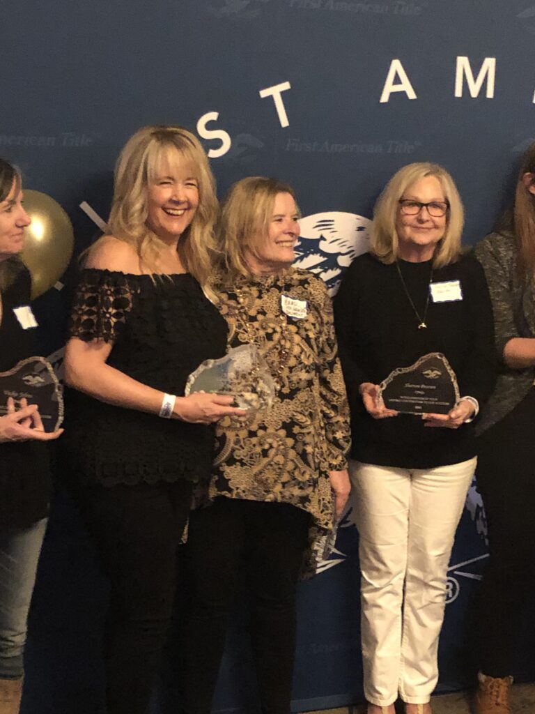 Employees of Longmont Title posing for camera